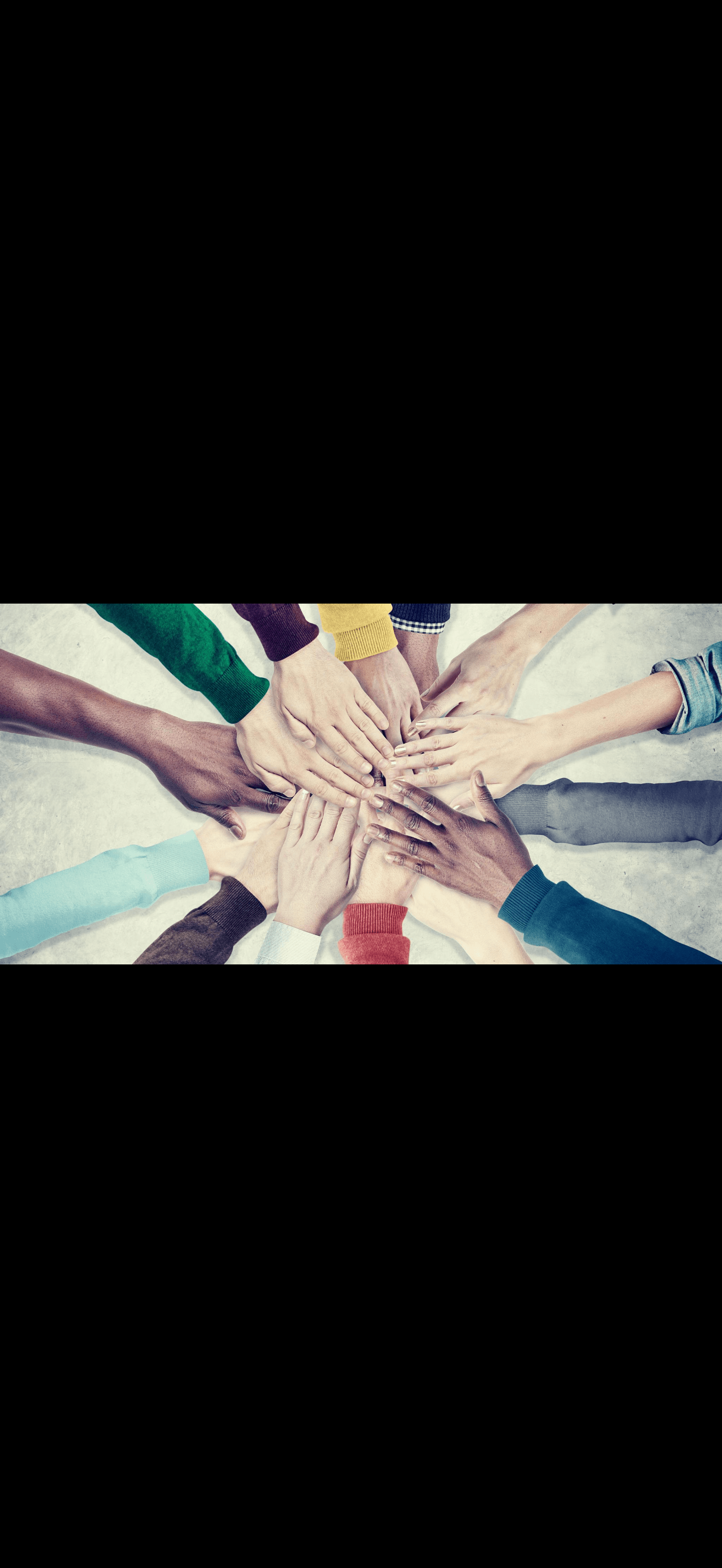 Diverse hands clasped together symbolizing unity and collaboration